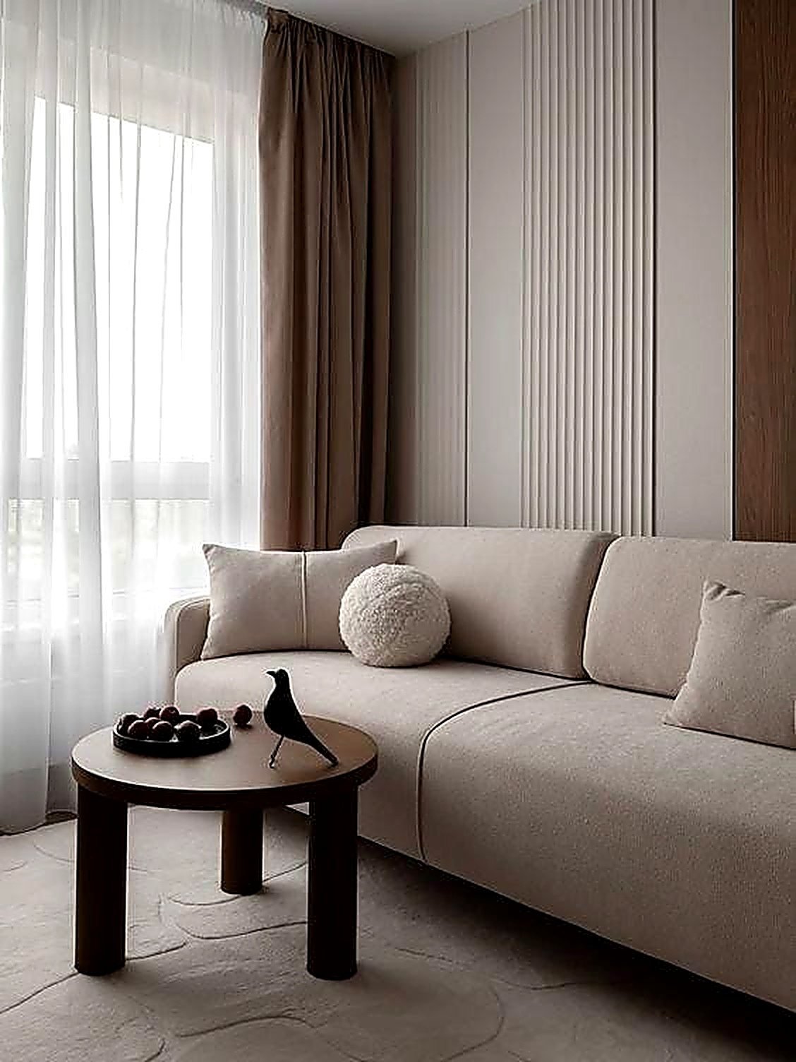 Living room with sheer linen drapes and fluted walnut panelling